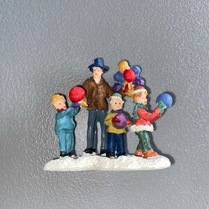 Colorful Family Figurine with Balloons